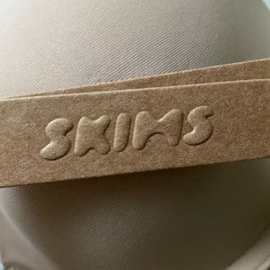 SKIMS mid tight bodysuit in Clay